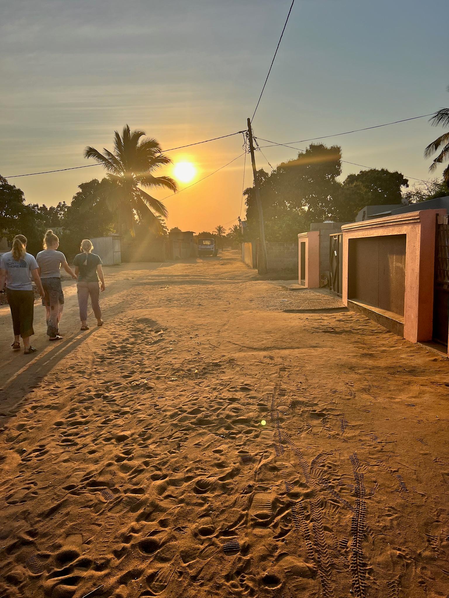 Team walking at sunset in Chokwe
